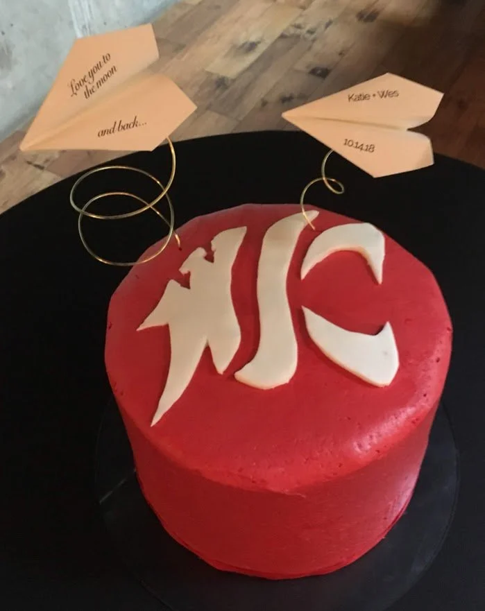 Grooms Cake Frosted in Red Buttercream White Fondant Washington State Cougars Logo and Paper Airplanes with Bride and Groom Names Wedding Date and Special Quote
