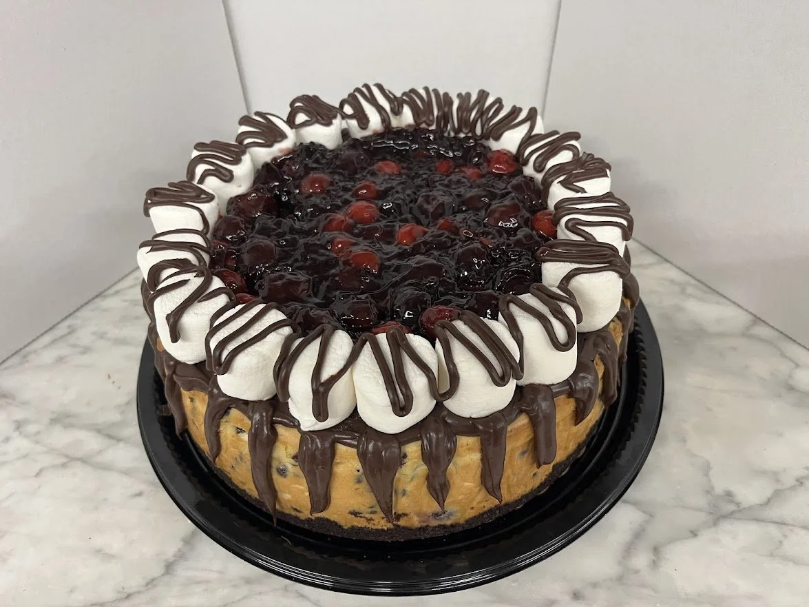 Chocolate Chip Cherry Cheesecake with Marshmallow Border and Piped Chocolate Accents