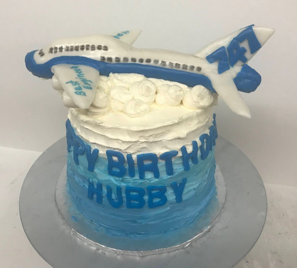 Fondant Sculpted 747 In Flight Above the  Buttercream Clouds Frosted Color Fade From Blue to White on Side Fondant Cut Letters on Birthday Cake