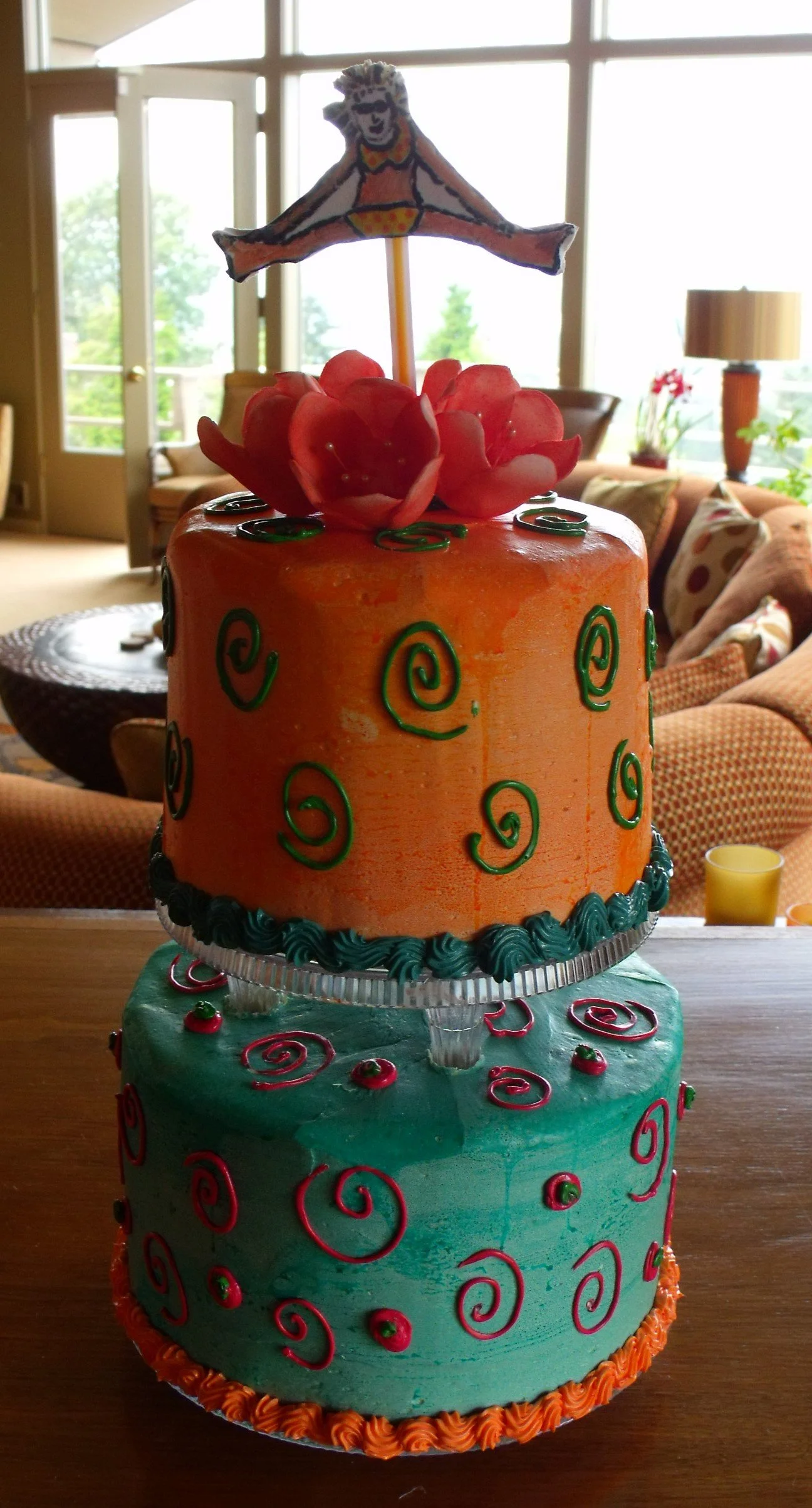 Birthday Cake Girl-Jumping Over Two Tiers Separated by Crystal Pillars Bright Orange and Teal Green Cakes with Piped Buttercream Scrolls Sugar Dusted Rose Pink Tulips Fondant Jumping Figure Edible Pen Decorated
