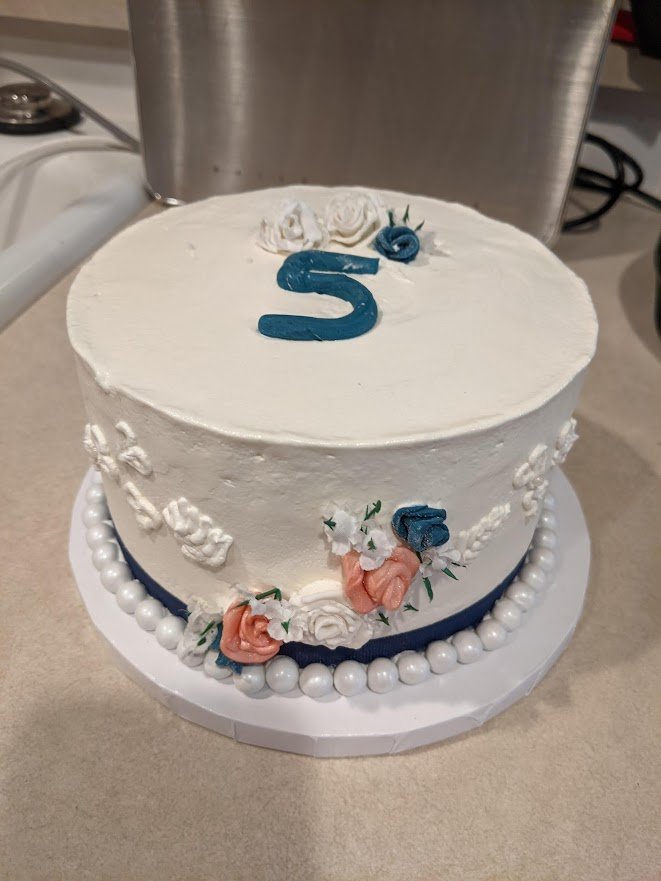 Gluten Free Dairy Free Egg Free Anniversary Cake Frosted in Dairy Free  Buttercream and piped Roses