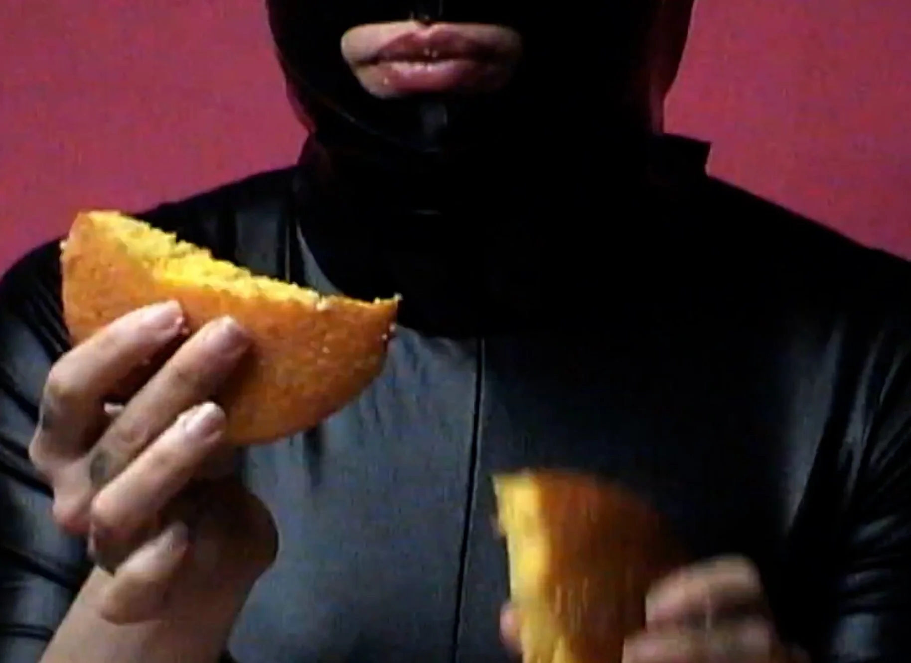 Person holding two slices of toasted bread