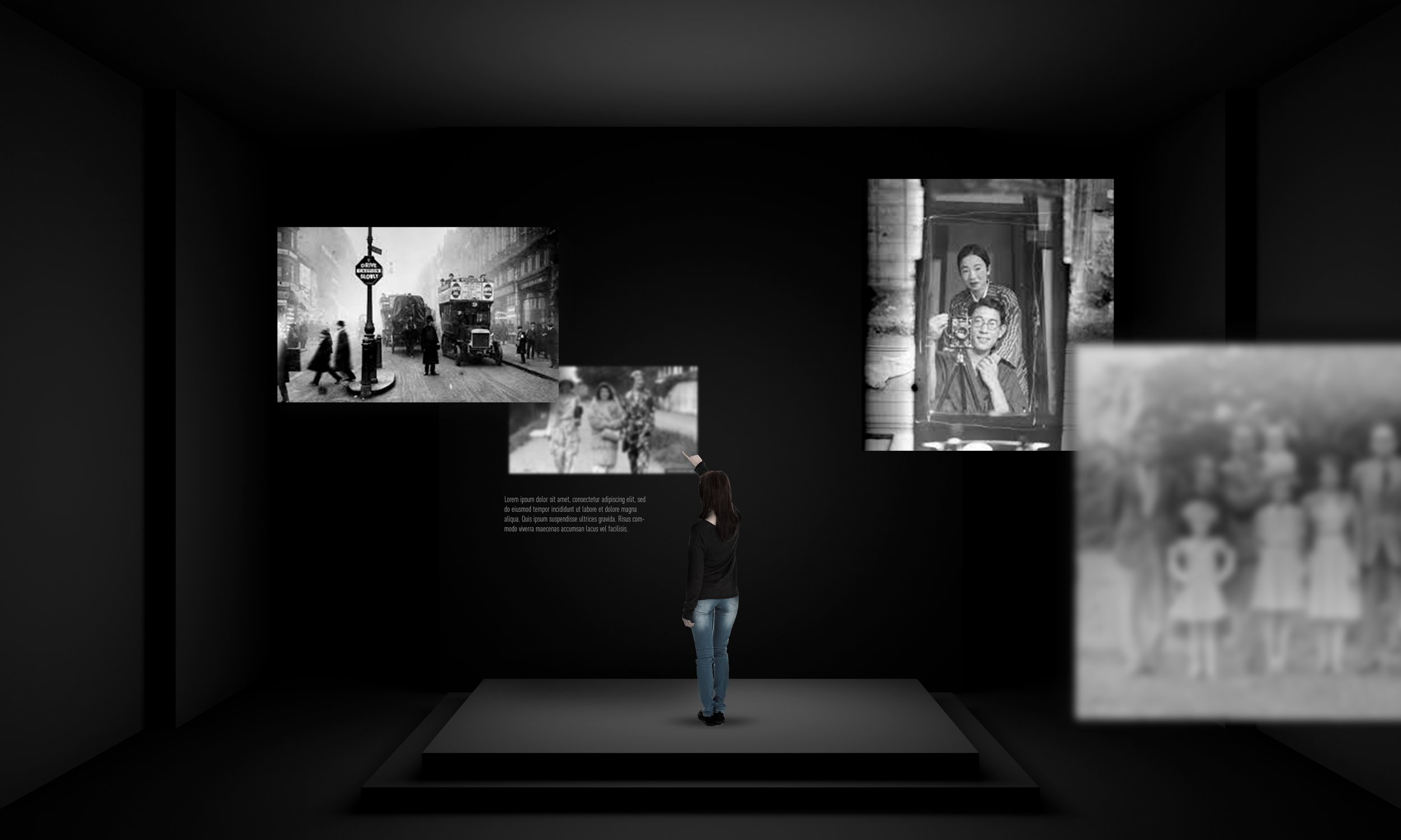 A person viewing black-and-white photographs and images in an art gallery with dark walls.