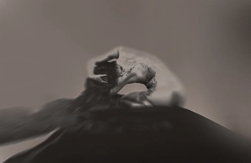 A black and white distorted image of a person covering their face with their hands, creating an abstract, surreal effect.