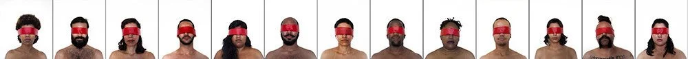 A series of individuals with red blindfolds covering their eyes, shown in a row. The image focuses on their upper bodies and faces, with varied skin tones and hair types.