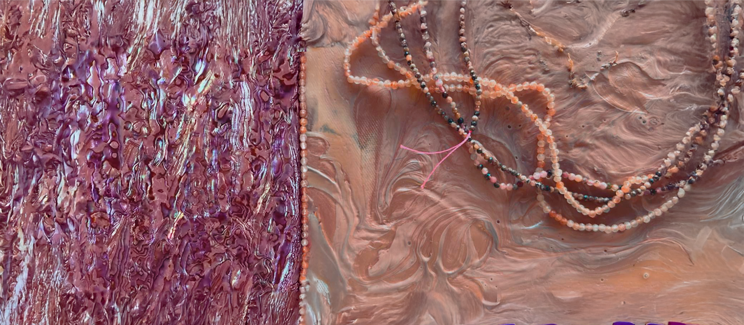 Close-up of layered textured art with purple, pink, and orange colors, featuring a string of multicolored beads on a marbled surface.