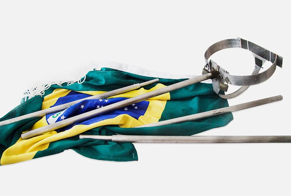 Brazilian flag with a metal headgear and poles on a white background.