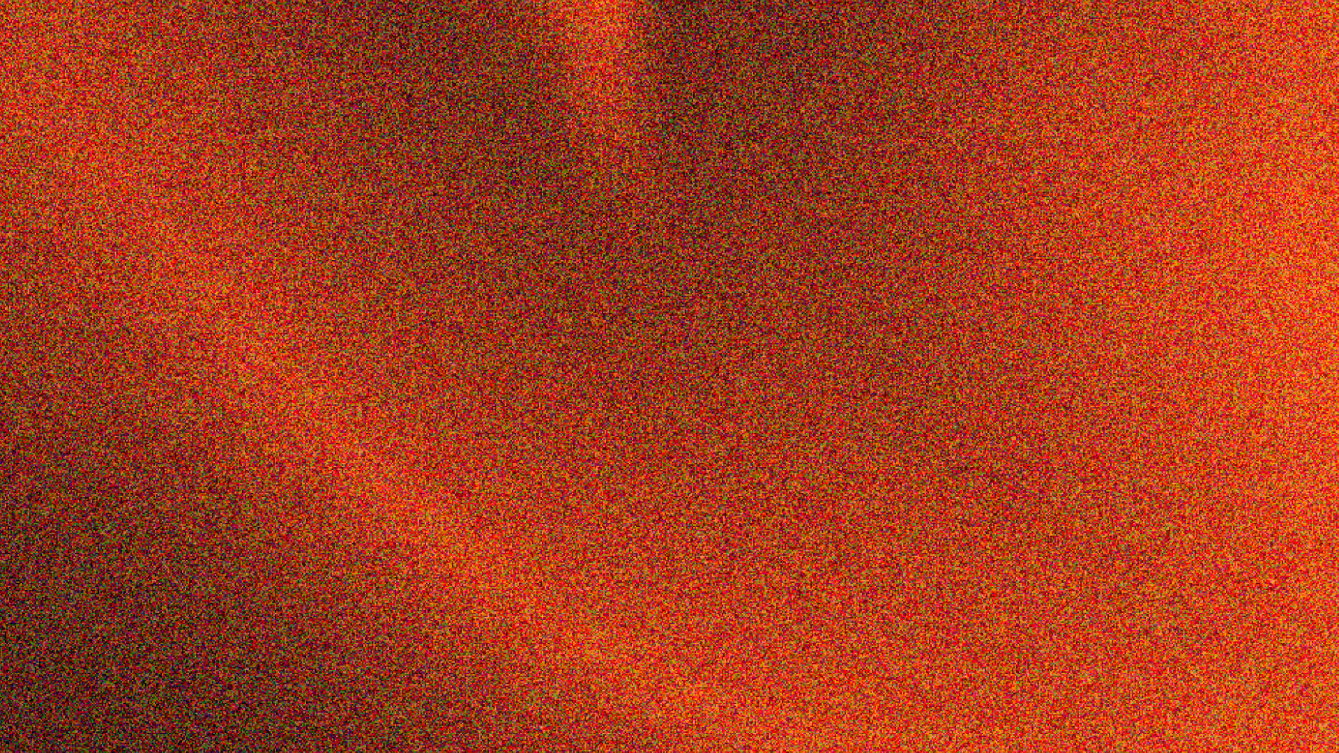 A red and green speckled pattern with no distinct objects or scenes.