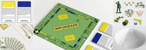 Photo of a Monopoly game board, game pieces, money, and various game components.