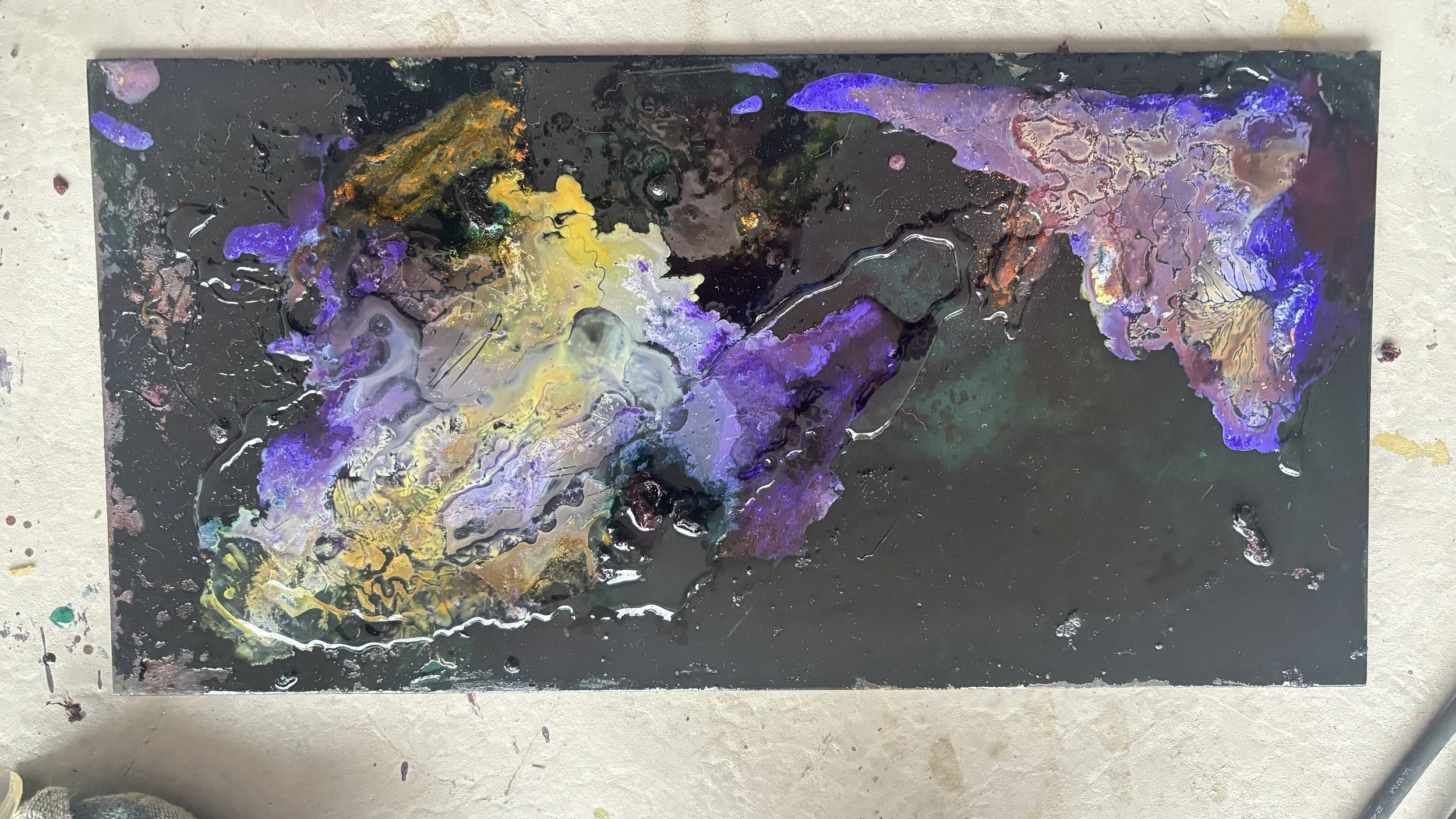 Abstract mixed media artwork with black background, swirling colors of purple, yellow, white, and hints of green and orange, with textured and layered paint.