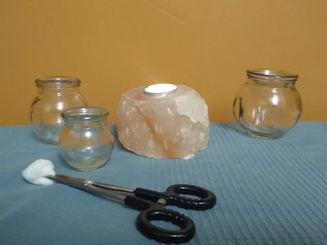 A person receiving cupping therapy on their back in a wellness clinic.