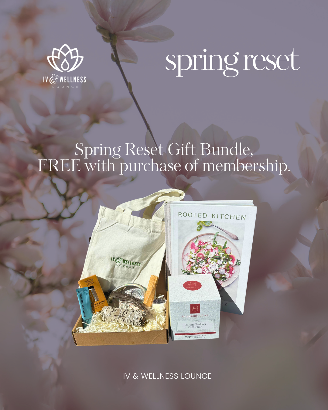 Spring reset gift bundle including a plant-based cookbook, tea, and wellness products, set against a background of blooming pink magnolia flowers.