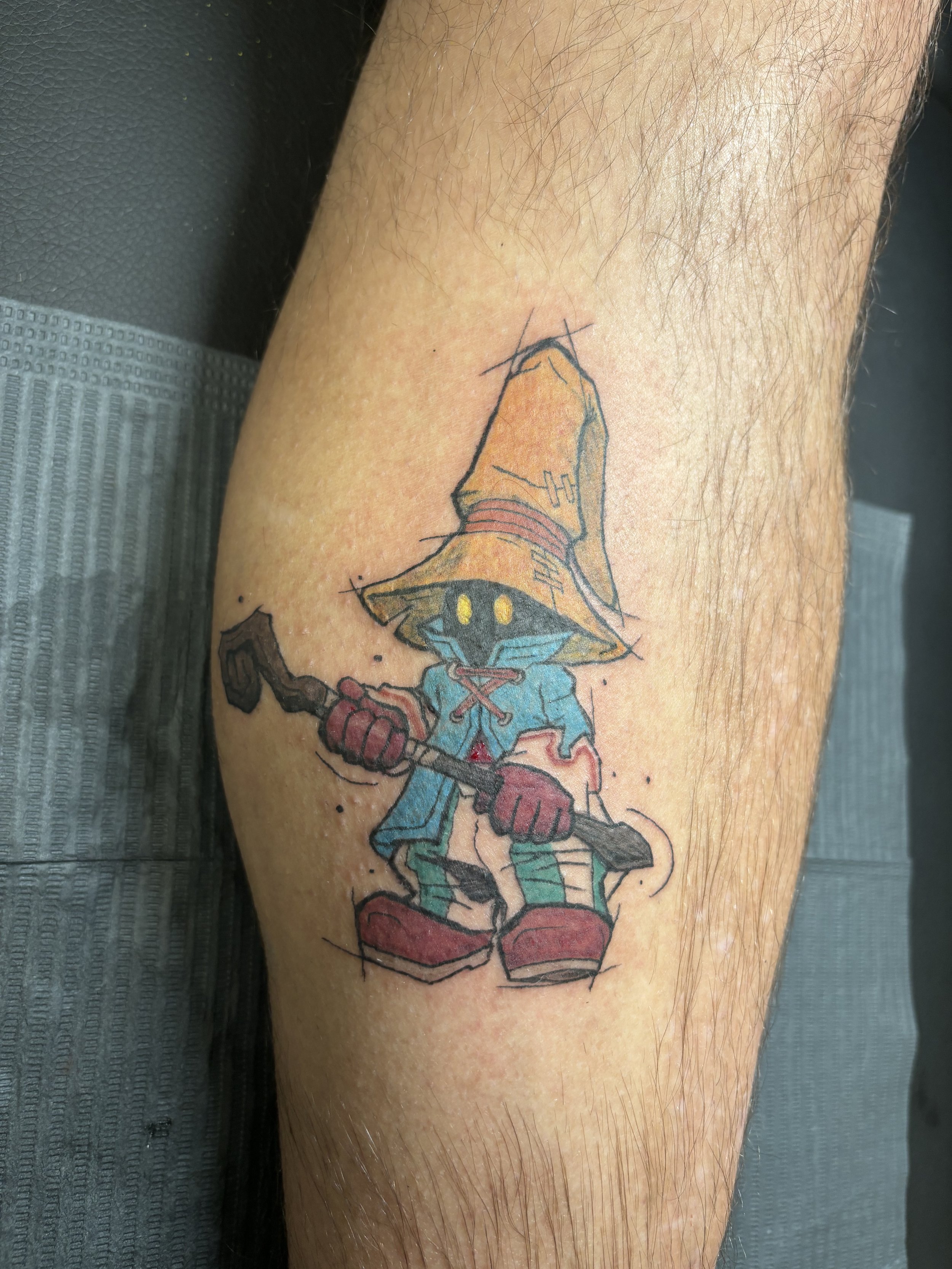 Neotraditional black mage tattoo