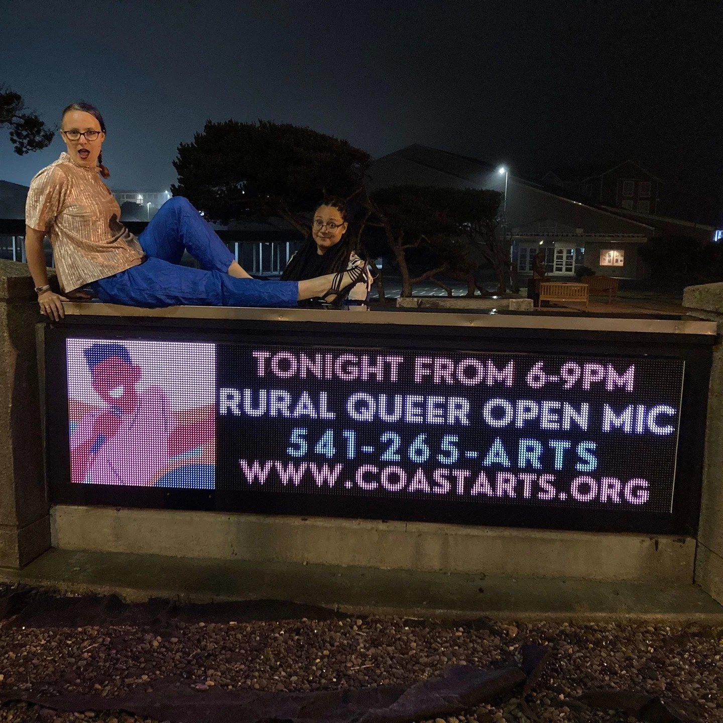 "The Rural Queer Open Mic Comes to Town," photography
AJ Savage (photographer), Dani Savage &amp; Marika Straw (pictured)
IG: @ruralqueeropenmic
Pride in Numbers Community Art Project

"In the summer of 2024, my friends Dani and AJ and