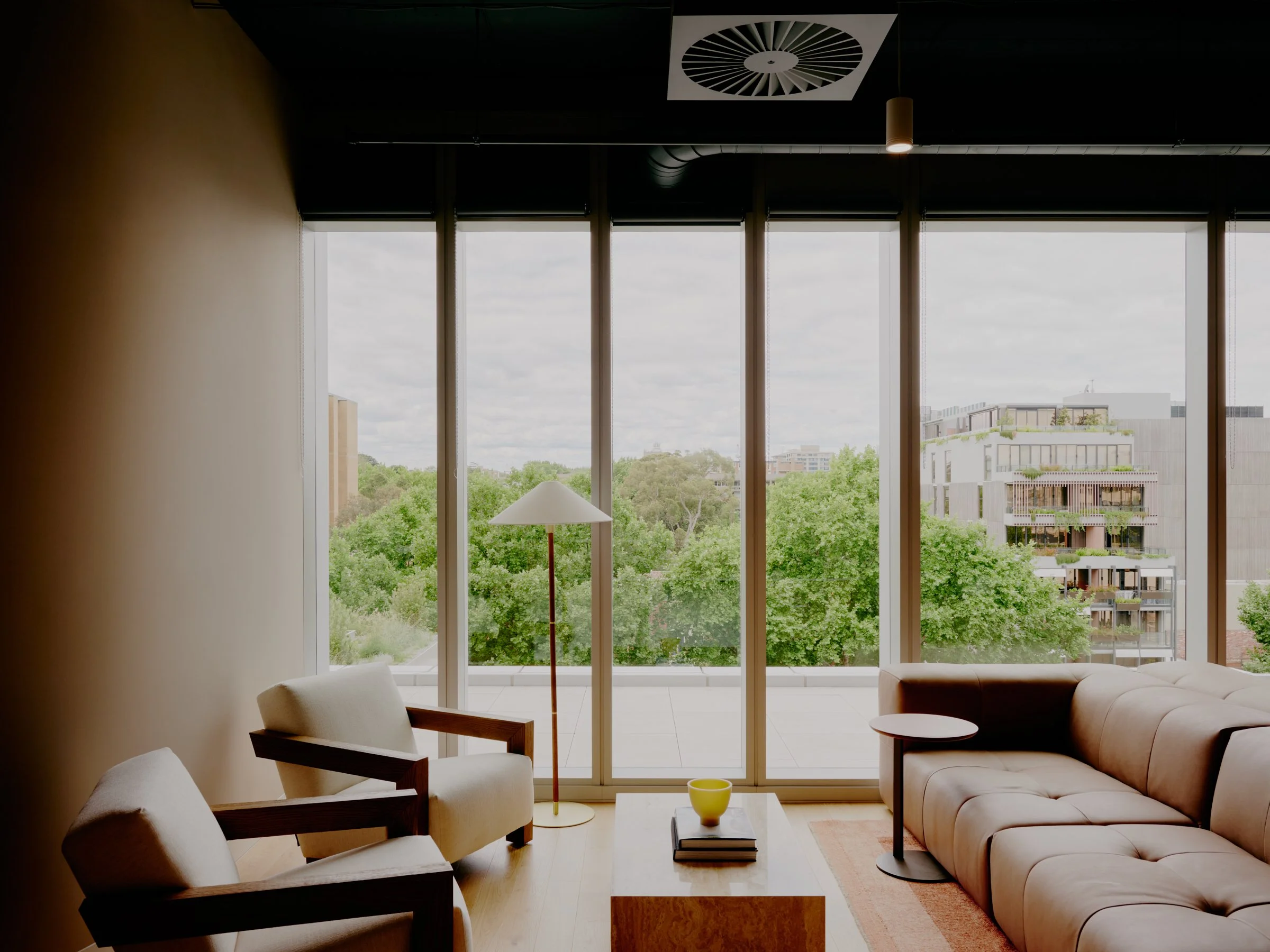 River Street office seating area with armchairs and large window
