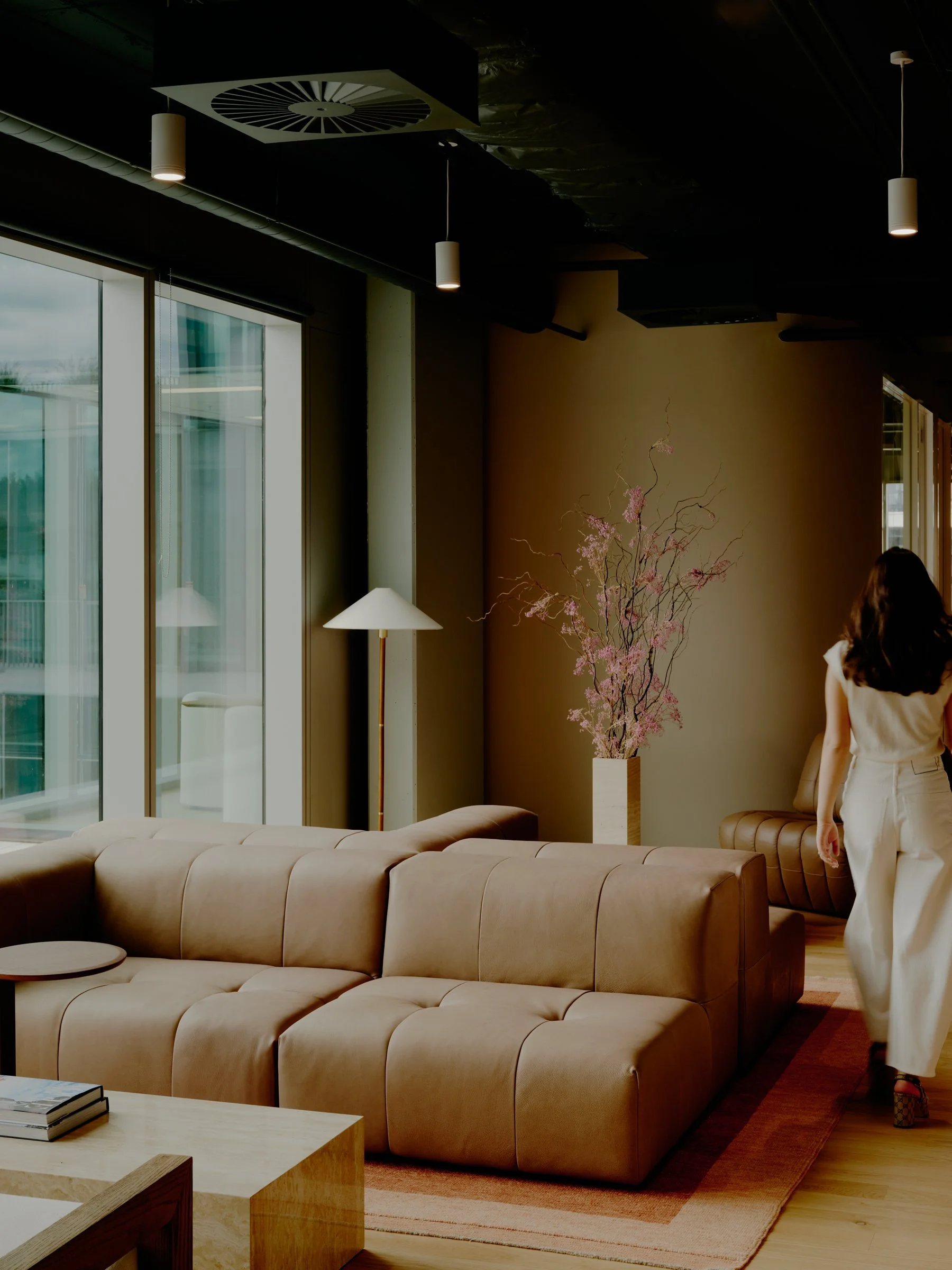 River Street office lounge with sectional sofa and floor lamp