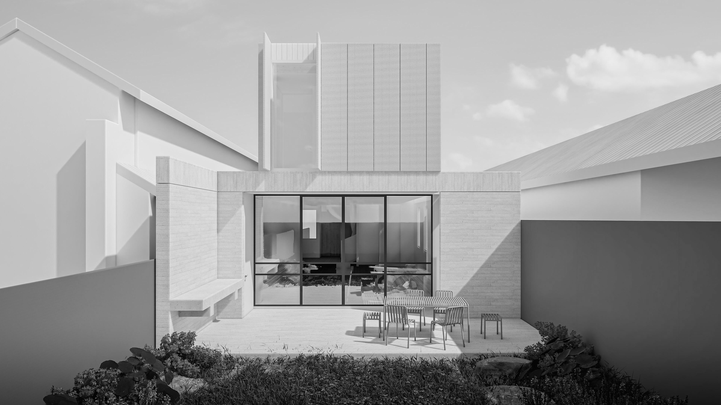 Modern white and gray house exterior with large glass doors, outdoor dining table, chairs, and small plants in the garden.