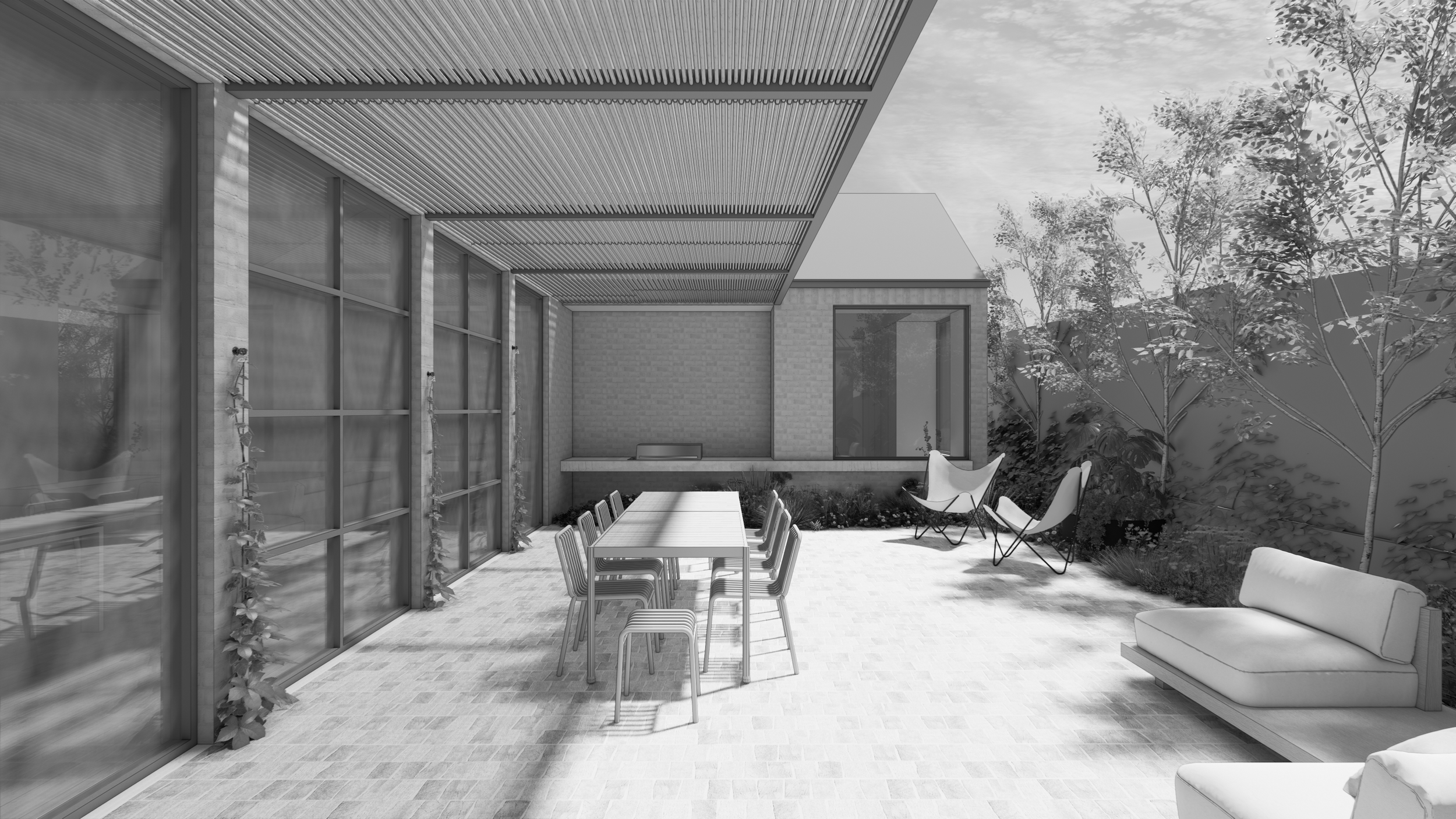 Modern outdoor patio with dining table, chairs, and lounge chairs, surrounded by trees and house walls with large windows and sliding glass doors.