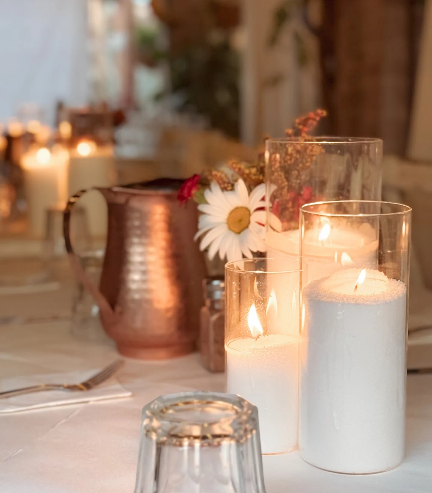 Soft candlelight, warm metallics, and delicate florals&mdash;featuring our signature sand candles for that clean, elevated glow ✨