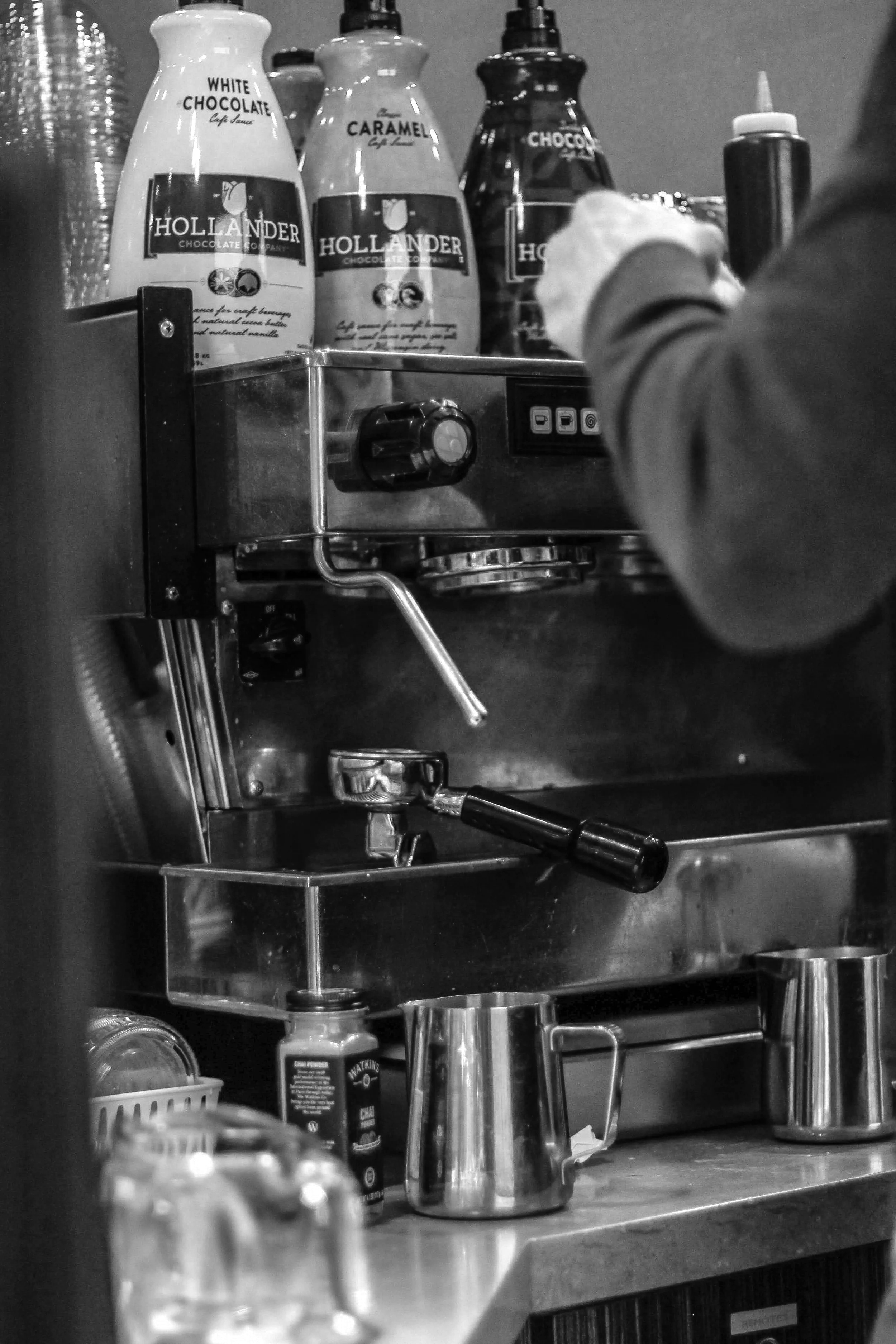 Person making drinks at an espresso machine