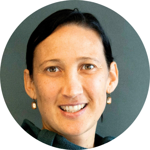 A close up photo of Eleanor's face. She is smiling and looking at the camera.