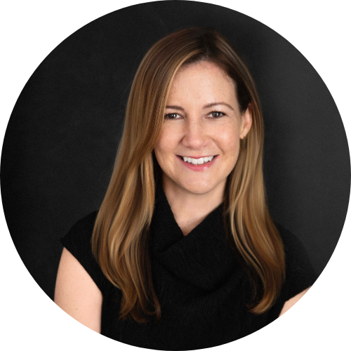 Portrait of Katie Connolly smiling at the camera, wearing a black shirt