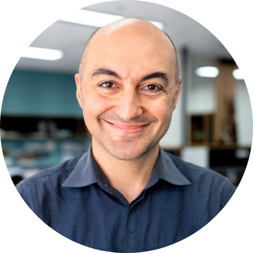 Photo of Daney Faddoul's head and shoulders in front of an office