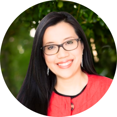 Portrait of Dr Selina Namchee Lo standing outside, smiling