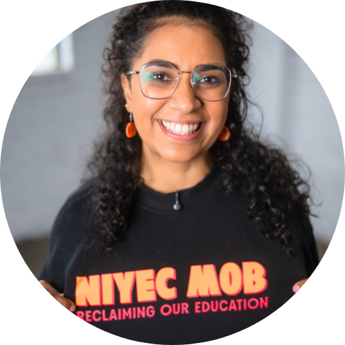 Image of Renee wearing jumper that says 'NIYEC Mob self-determining our education'