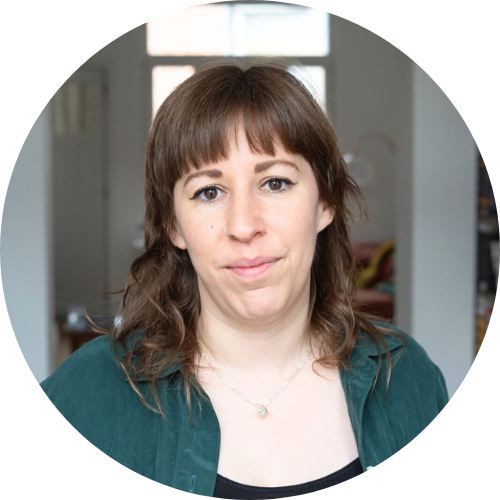 Fenya Fischler smiling at camera, wearing a green shirt