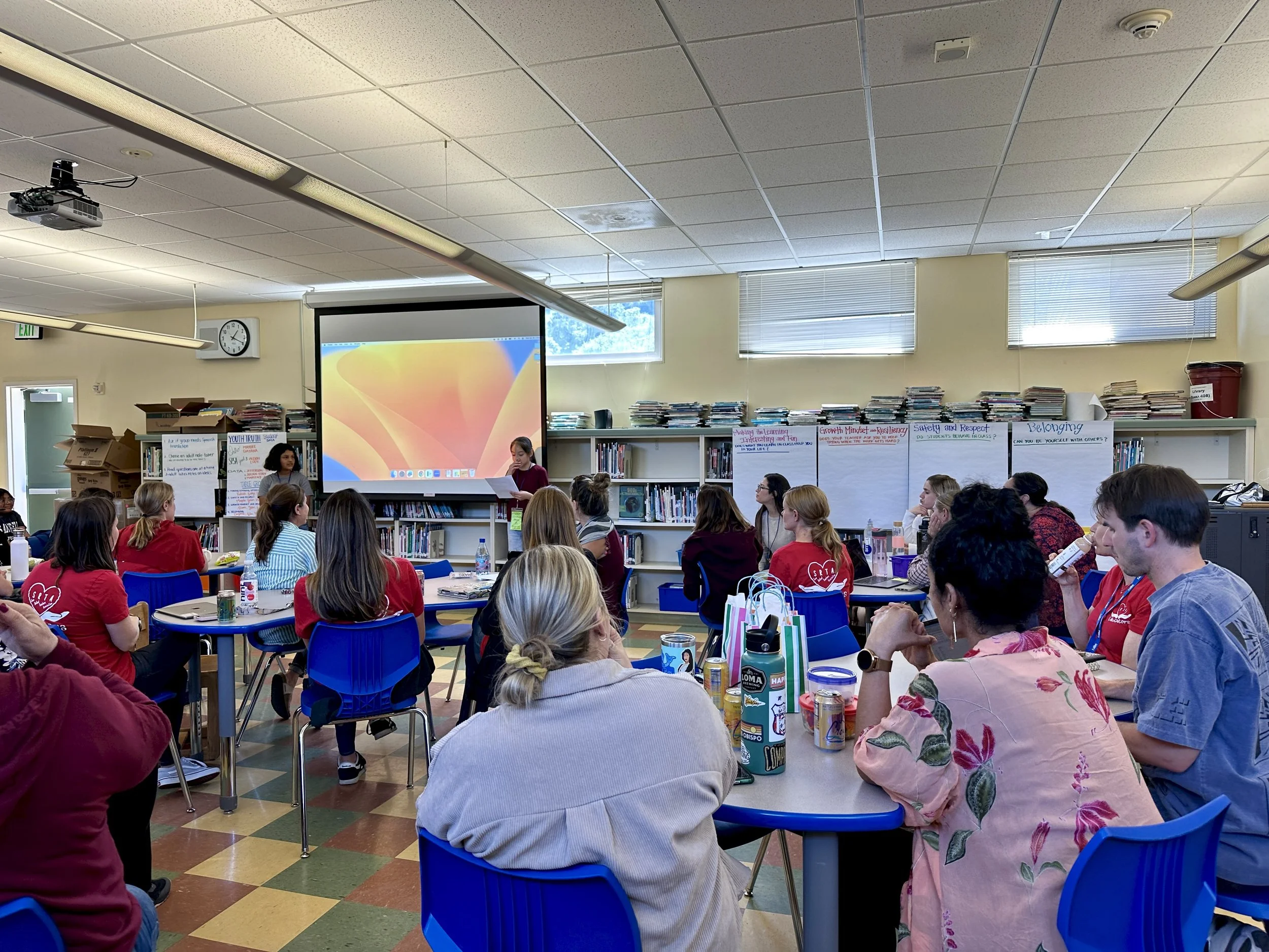 Room of educators during a staff training on healing practices.