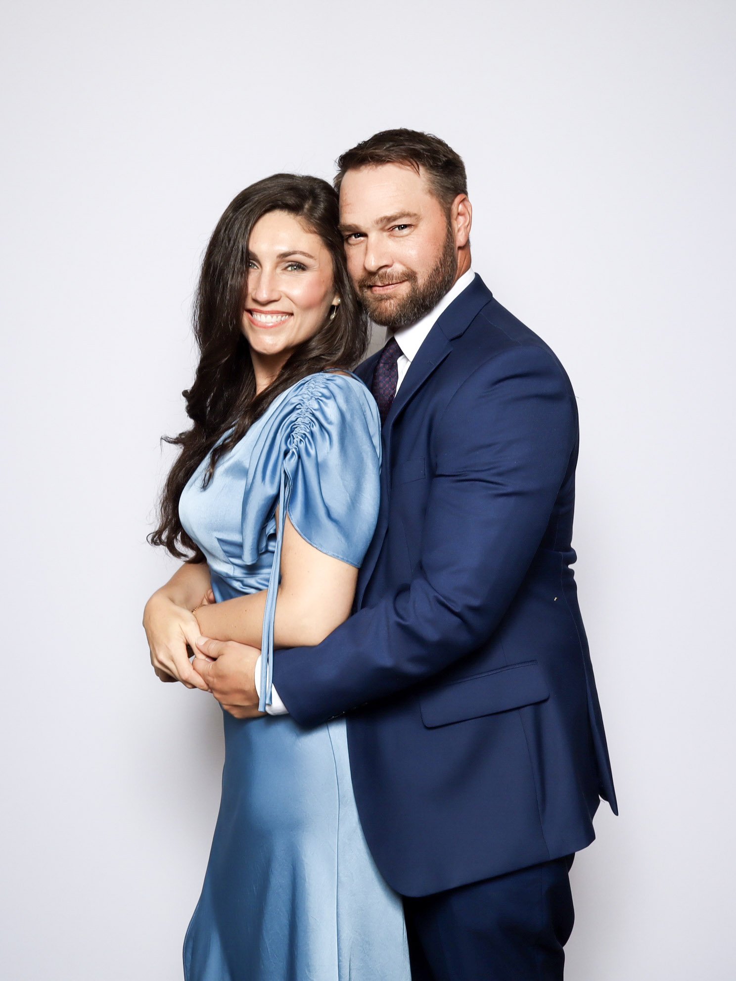 Wedding guests smiling and posing together at a digital photo booth setup during a celebration at The Robinshaw in Rossville, Tennessee. Keywords: wedding photo booth rental, event entertainment, guest photo experience, West Tennessee vendors.