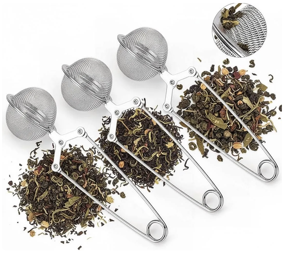 Four tea strainers resting on a variety of loose leaf herbal teas