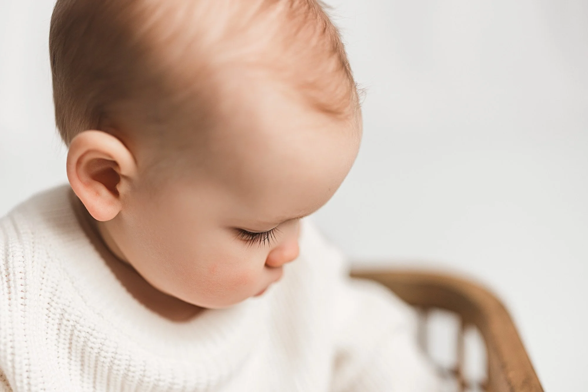Close-up detail of a baby’s soft eyelashes and cheeks photographed during a Seattle area baby photography session by Atsumi Sullivan.