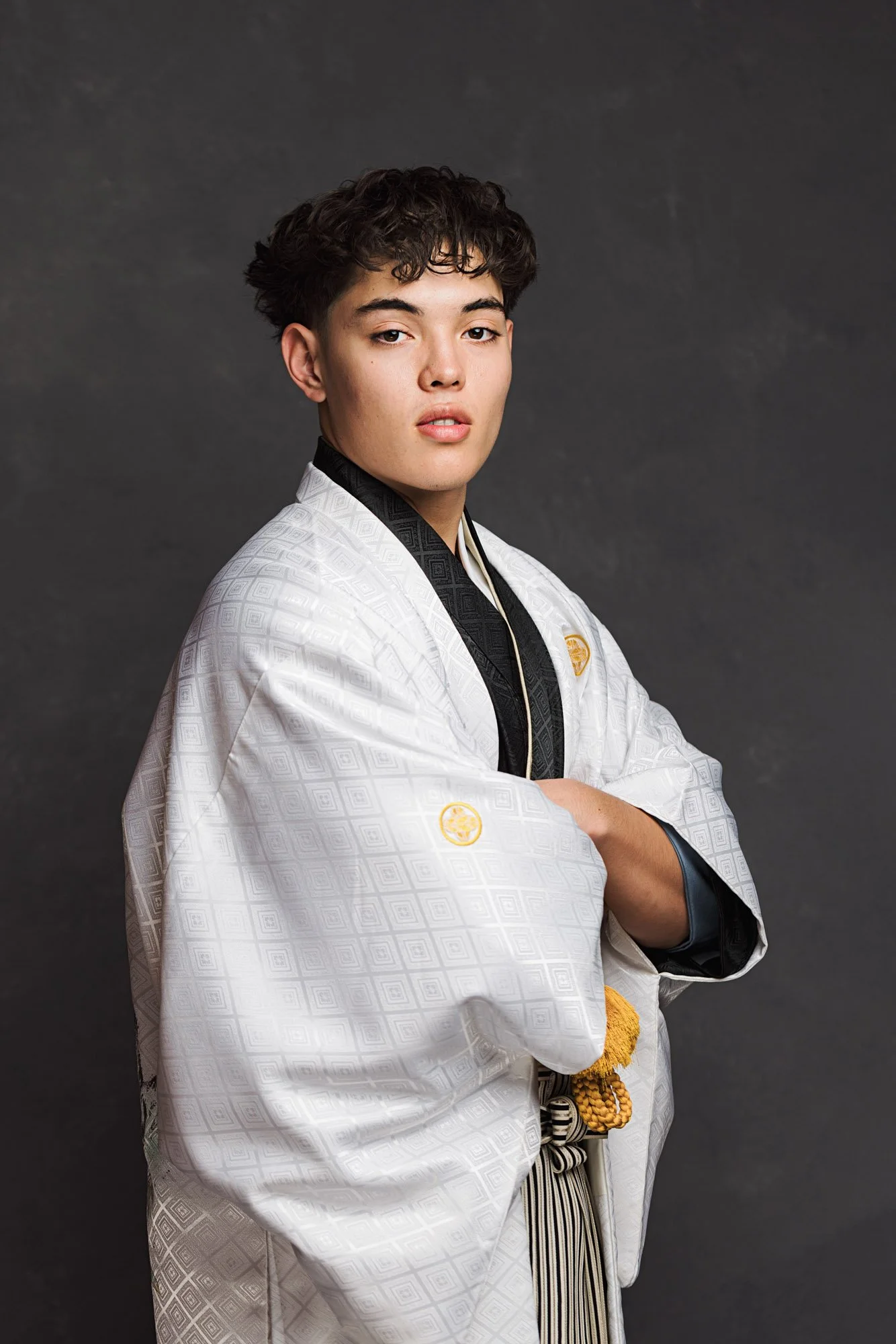 Young man in traditional kimono during a coming of age portrait session in a Kirkland studio.