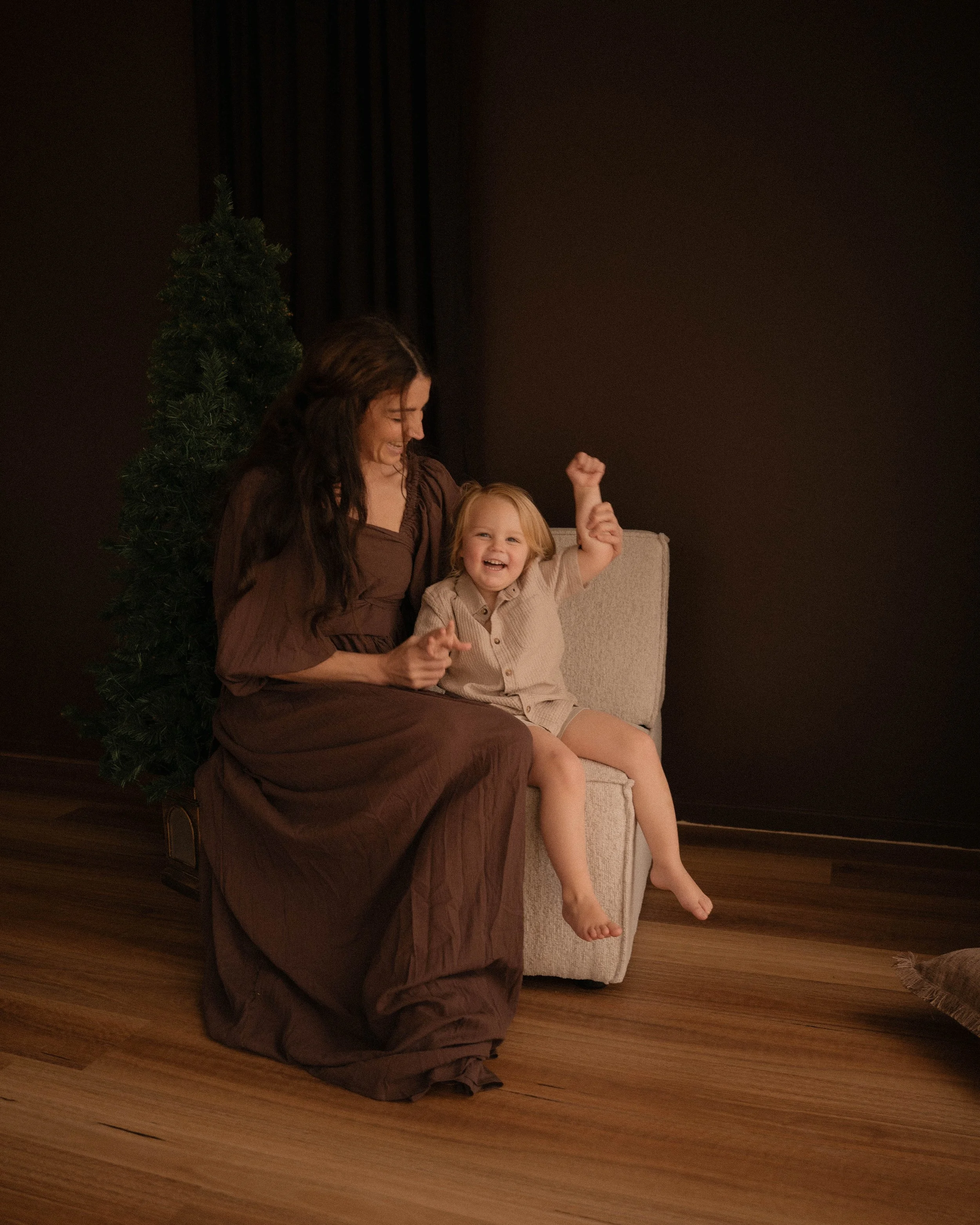 Christmas mini photo session of a mother and her little boy in the warm cozy whittlesea studio