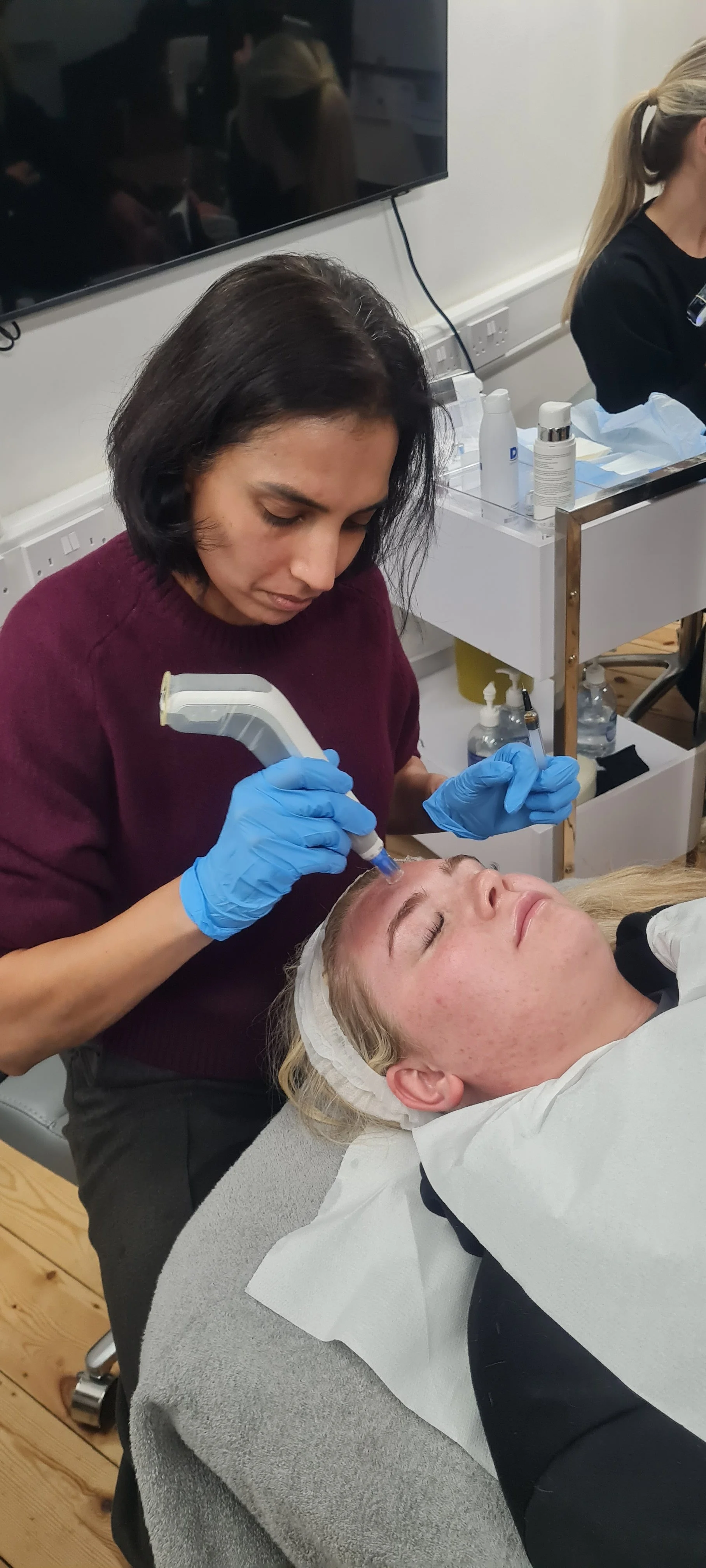 Arwa performing a Dermapen4 microneedling treatment at Elemental Aesthetics Cambridge