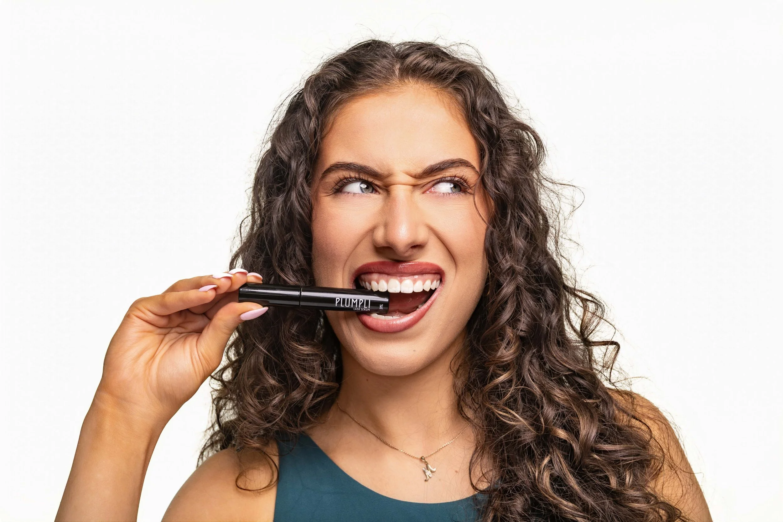 A beautiful brunette model showcasing eye make up with a white background