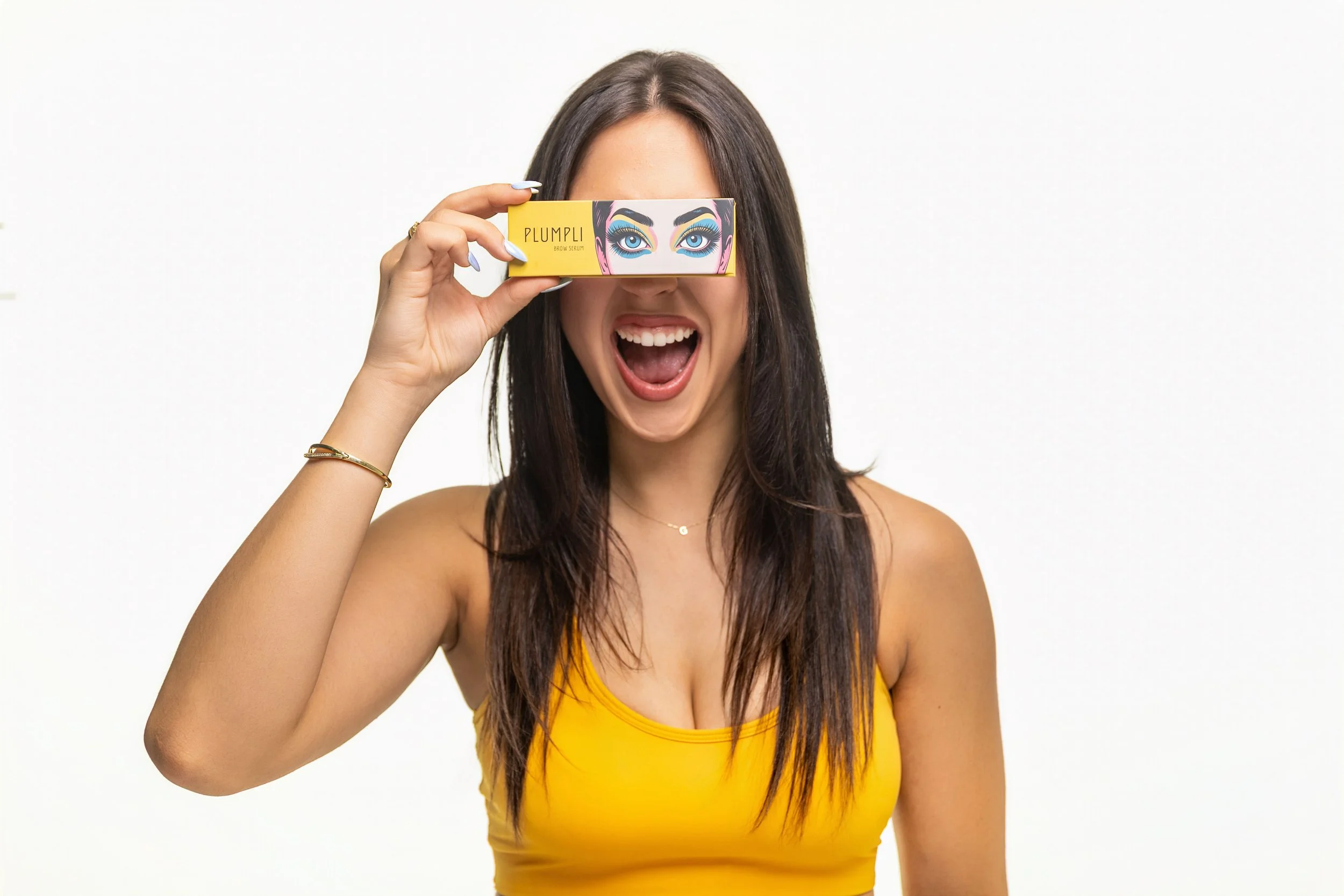 A beautiful brunette model showcasing eye make up with a white background
