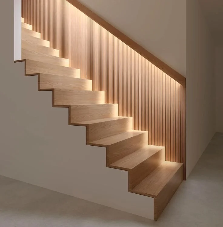Modern wooden staircase with integrated lighting and a wooden slat wall background.