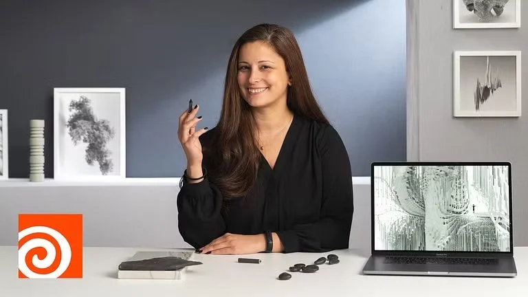 Black and white portrait of a smiling man with light-colored, wavy hair, wearing a white collared shirt, against a plain background.