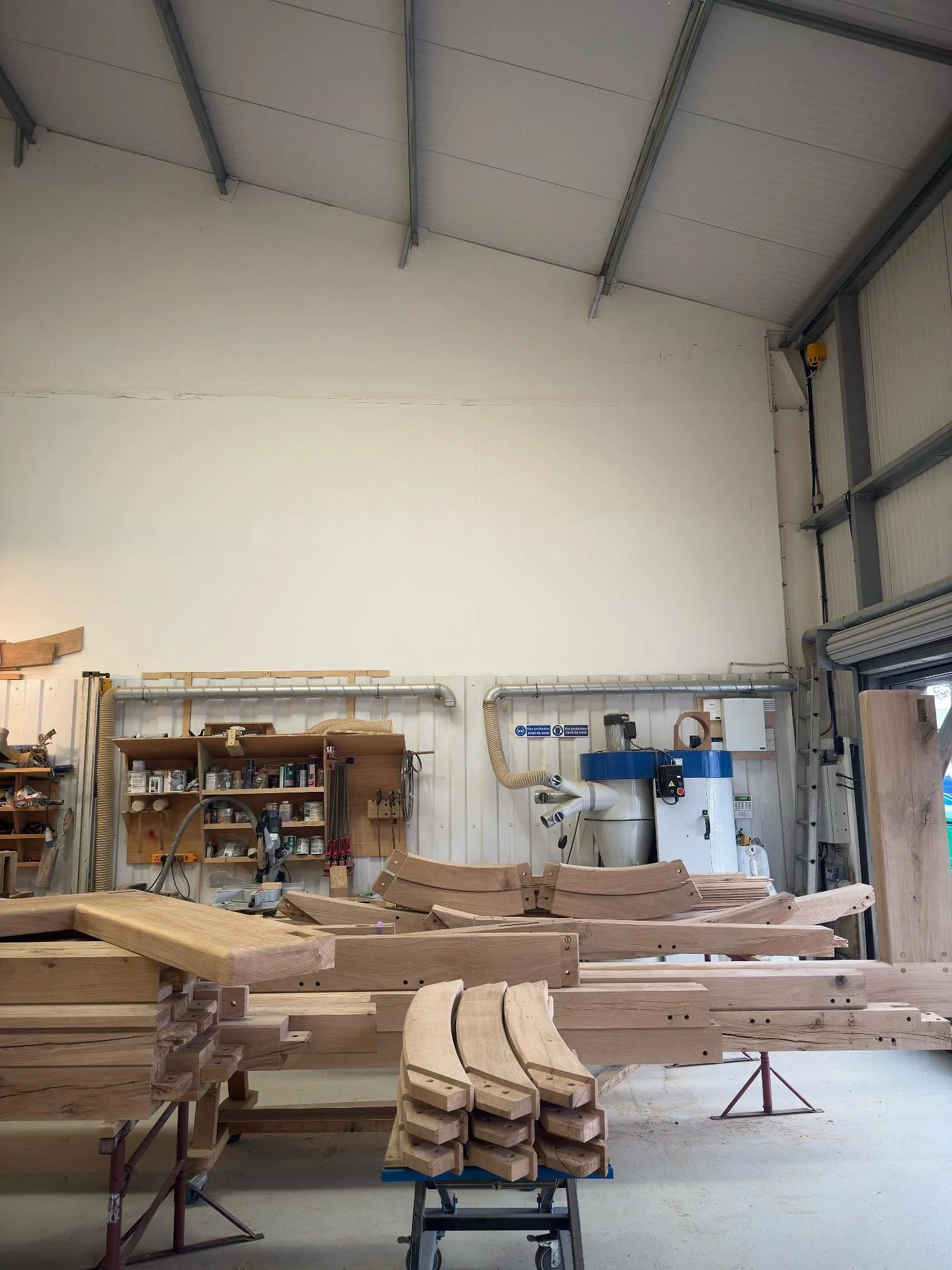 All the elements finely tuned for assembly next week. 
Posts
Beams
Swept grain braces
Arched Queen posts
Waisted King posts
Ridge beams
Principle rafters
Wide sole plates 
Dried oak, ready.