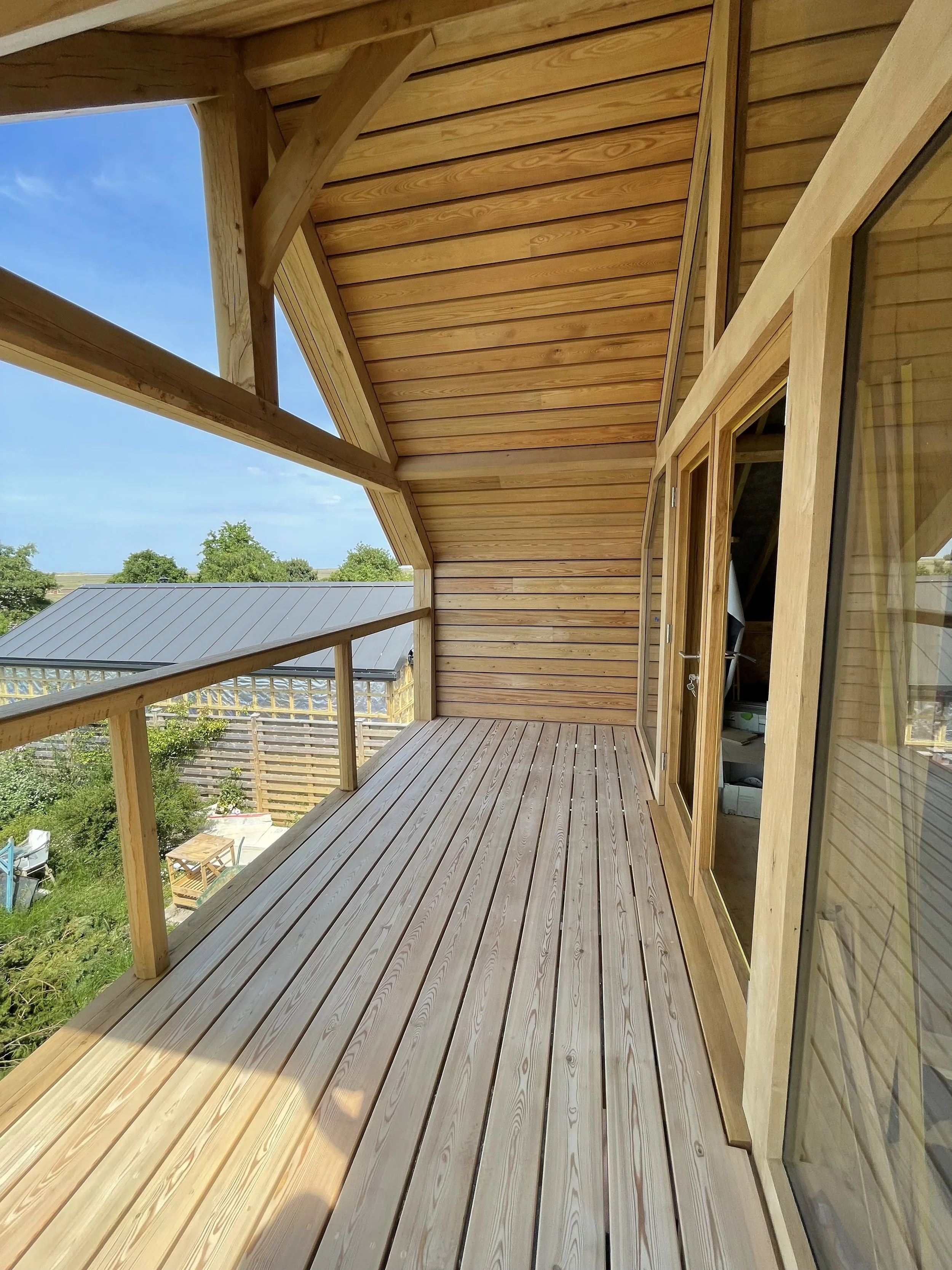 Larch floored and clad balcony