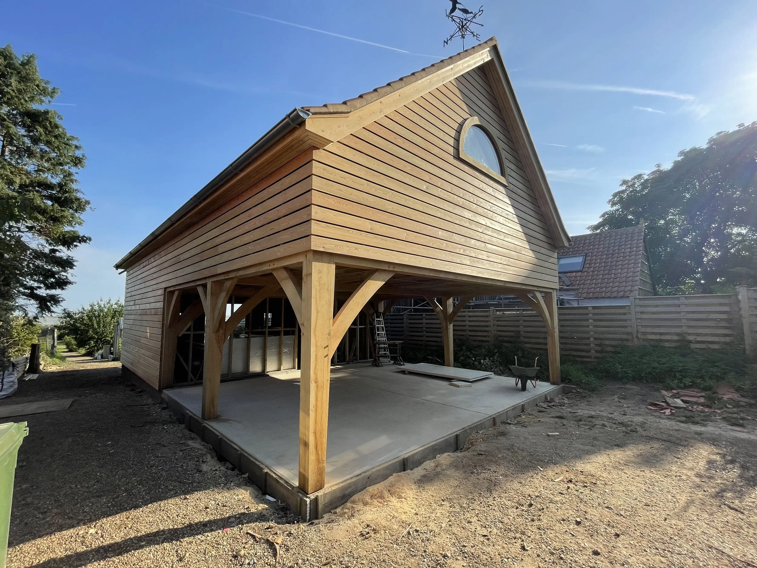 High level semi circular oak frame window