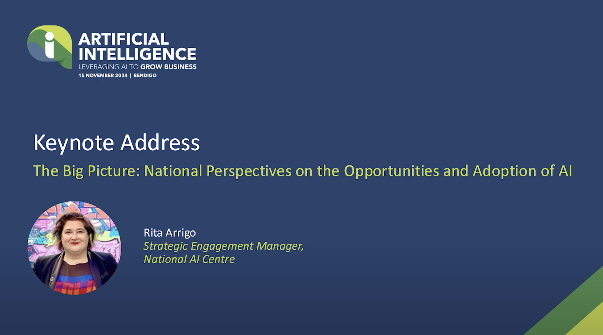 Title slide for an artificial intelligence conference featuring a keynote address titled 'The Big Picture: National Perspectives on the Opportunities and Adoption of AI.' Includes a photo of Rita Arrigo, Strategic Engagement Manager at the National AI Centre, and the event details indicating it takes place in Bendigo on November 15, 2024.