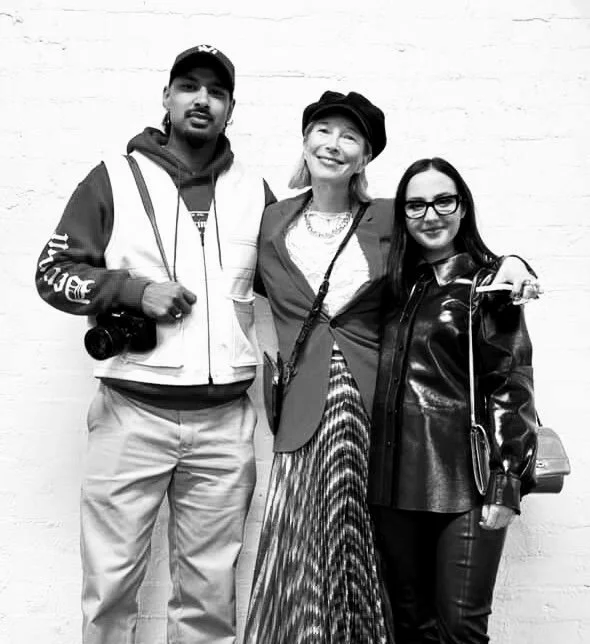 Explore TRIPLE AXEL - a revolutionary new platform designed to address talent retention, mentorship solutions and career resources. A unique business model devThree people posing in front of a brick wall, two women and one man, smiling at the camera.