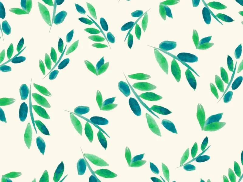 Watercolor painting of green and blue leaves scattered on a white background.