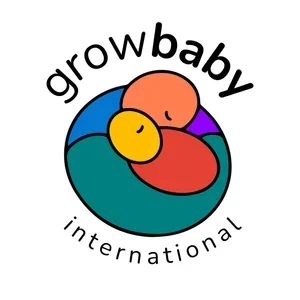 A logo with a stylized illustration of a baby in shades of orange, yellow, red, purple, and teal, sitting inside a teal circle. The words "growbaby" are above the circle and "international" below, forming a circular design.