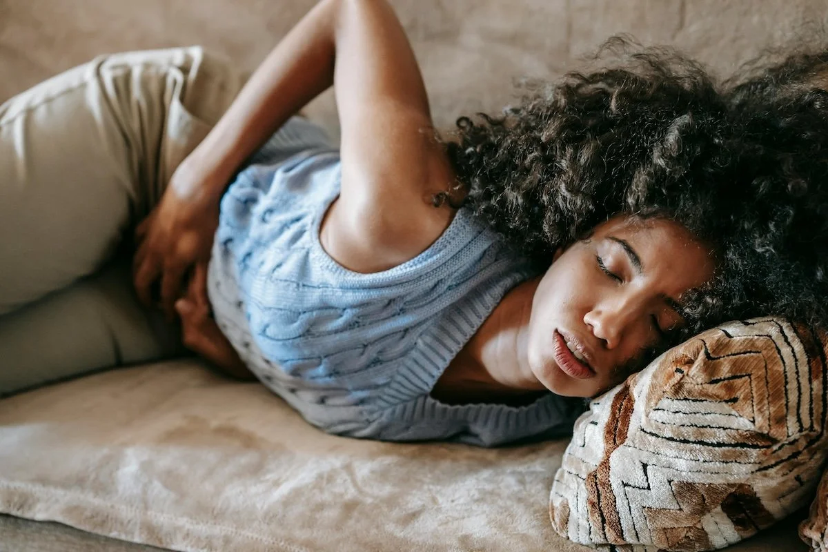 Young woman experiencing painful menstrual cramps