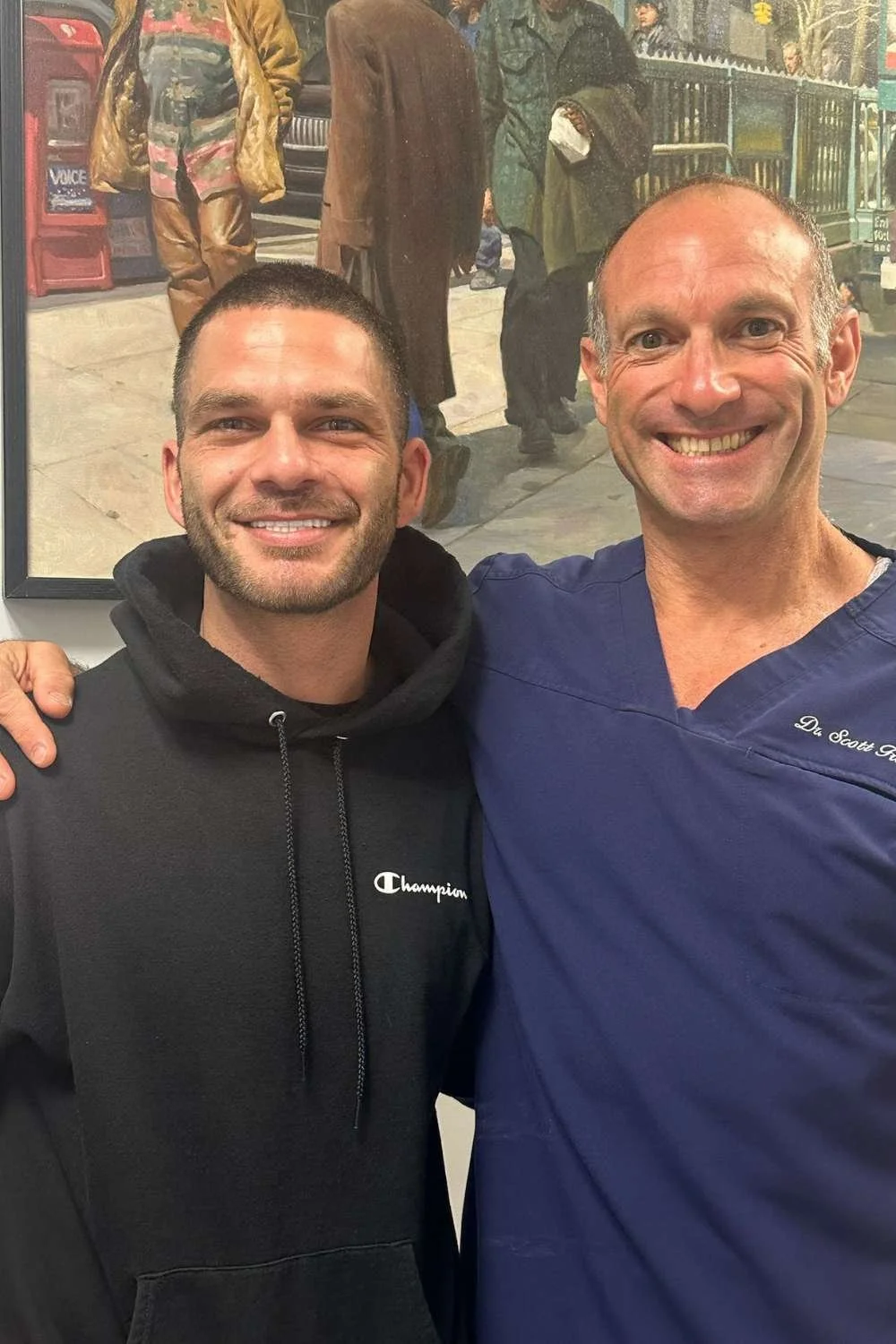 Dr Scott Froum, dentist, smiling with patient.